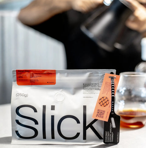 Pack of Slick Coffee Co. Bishan Wate Espresso Roast – Ethiopian coffee with fruity notes of apricot, strawberry, and Earl Grey.