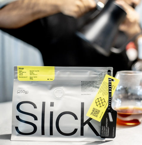 Ninga honey-processed Bourbon coffee pack by Slick Coffee Co., featuring deep notes of brown spices, raisin, and prune.
