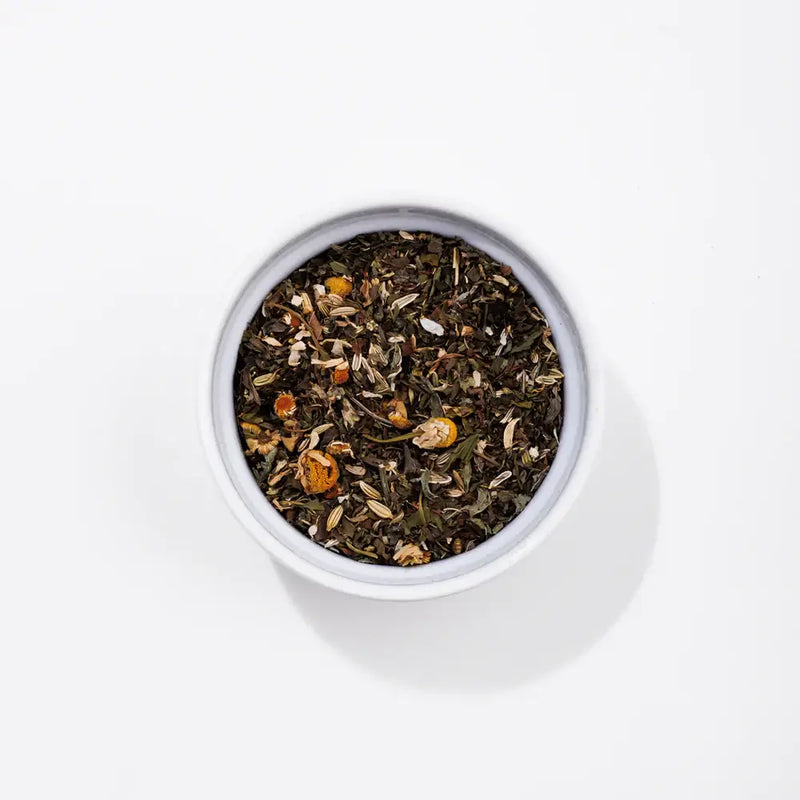 Tummy Tea with chamomile, lemon balm, peppermint, and fennel—an organic herbal blend designed to soothe digestive discomfort and promote gastrointestinal health for a gentle, natural remedy.
