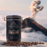 Ultra Premium Volcanic Limited Reserve Espresso canister with coffee beans, set against a volcanic eruption backdrop.