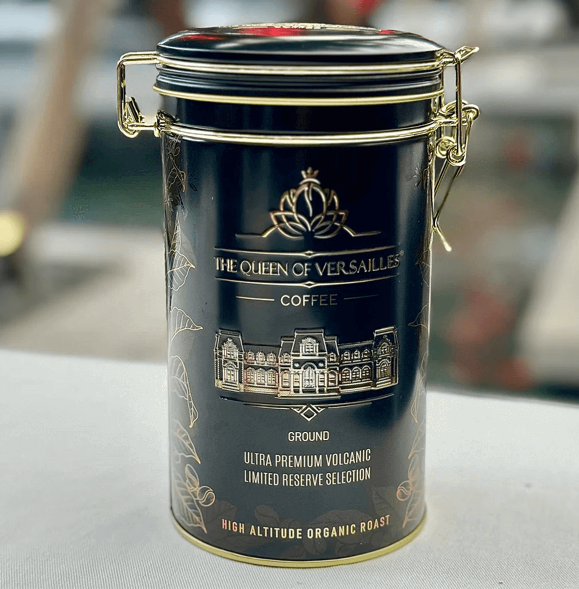 Ultra Premium Volcanic Limited Reserve Espresso can by Queen of Versailles Coffee, high altitude organic roast in elegant packaging.