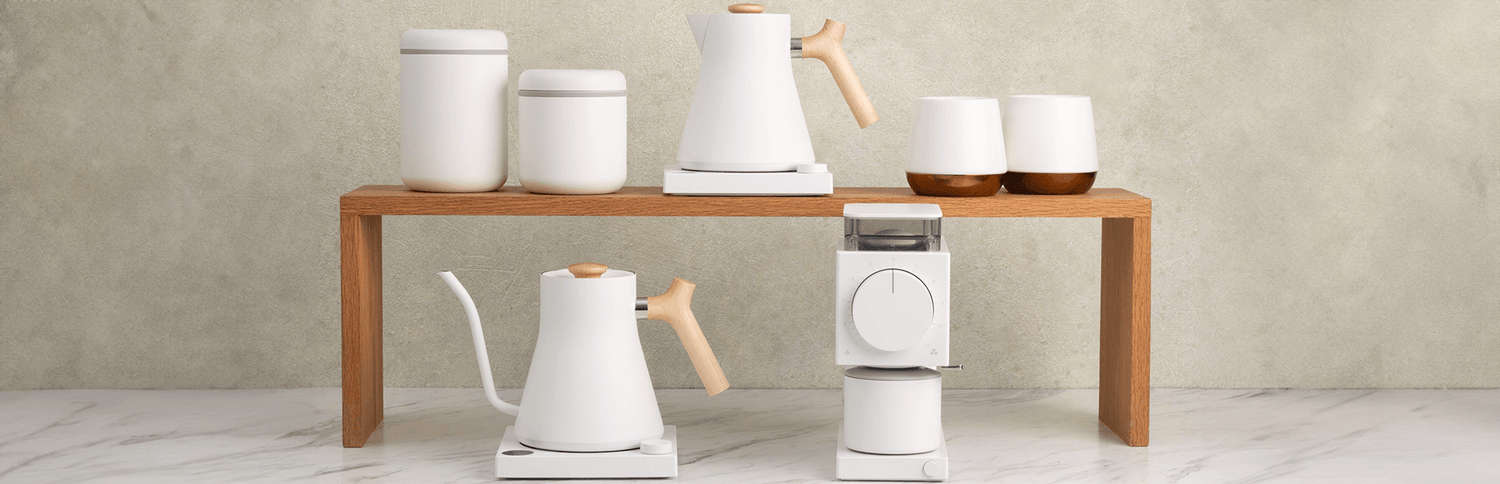 Elegant drinkware and accessories for coffee, tea, and matcha on a wooden shelf, perfect for any UAE gifts or hampers.
