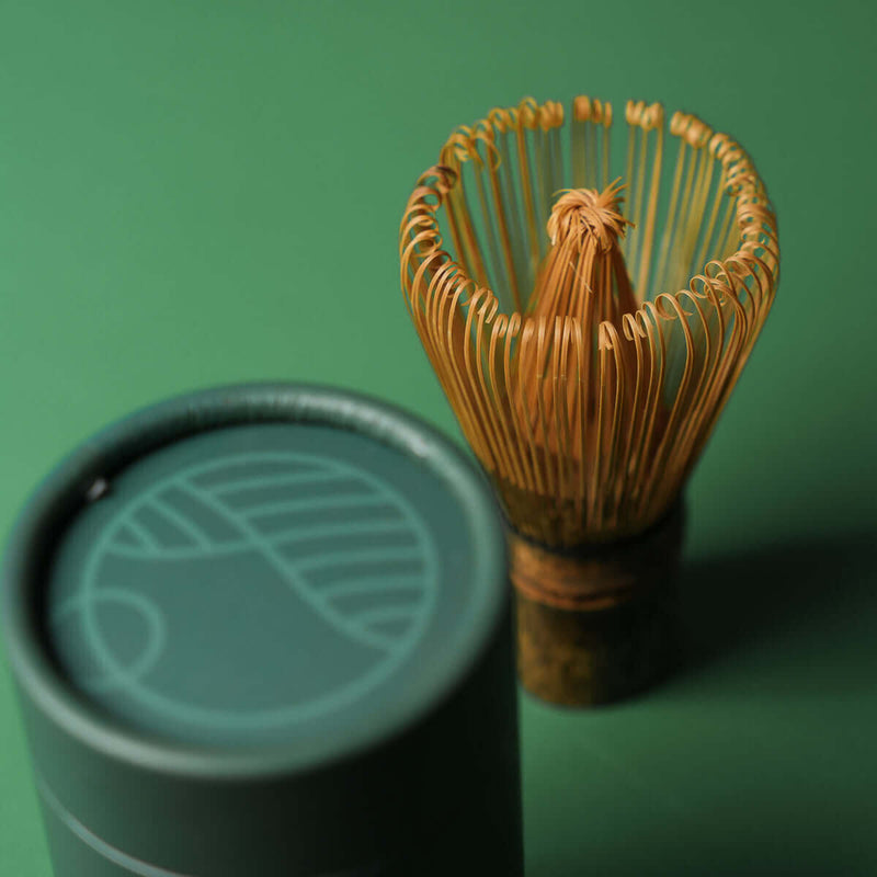 Handmade purple bamboo Matcha whisk with 80 prongs, perfect for thick and thin Matcha tea. Includes travel/storage sleeve.