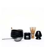 Yoocha Ceremonial Matcha Kit: Organic matcha, bamboo whisk, scoop, strainer, ceramic bowl, and whisk holder for authentic tea rituals.
