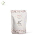 African Sunrise caffeine-free vanilla Rooibos tea blend in elegant packaging, perfect for any time of day.