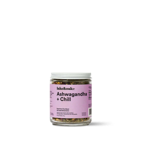 Ashwagandha + Chill Superfood Tea in a glass jar with a pink label, promoting relaxation and well-being.