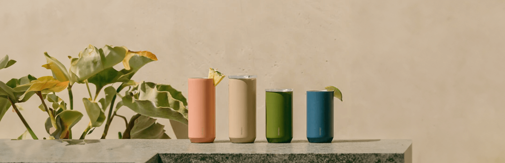 Colorful drinkware collection on a stone surface, perfect for coffee, matcha, and tea lovers in Dubai, UAE.