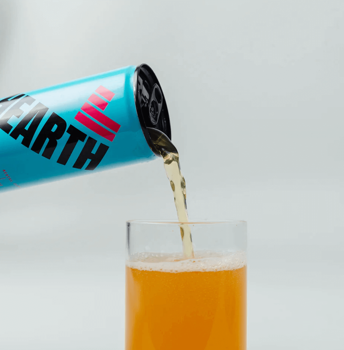 Drink Hearth Pink Grapefruit & Ginger beverage with bold, zesty citrus flavor and a spicy ginger kick—refreshing and all-natural delight.