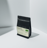 Brazil Natural Fazenda IP coffee bag showcasing rich flavors and tasting notes.
