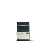 Brazil Natural Fazenda IP coffee package featuring tasting notes of milk chocolate, caramel, almond, and raisin.