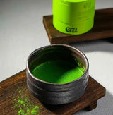 Ceremonial Matcha - Uji, Kyoto in a rustic bowl, showcasing vibrant green color and rich texture.