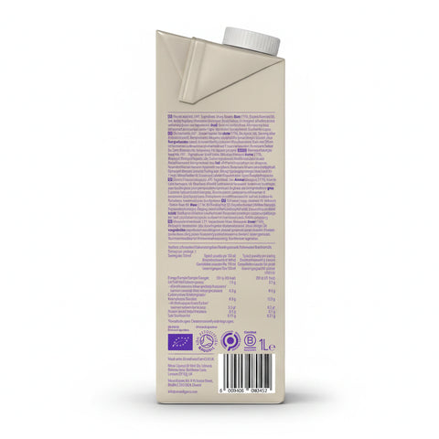 A carton of Minor Figures Organic Barista Oat Milk with latte art in the background. — view 3