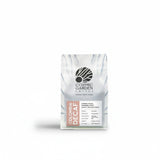 Cosmic Garden Coffee Colombia Decaf specialty roasted coffee beans with almond, peach and tamarind tasting notes