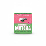 A pouch of Perfected Matcha Strawberry Matcha Powder with a whisk and a prepared matcha latte.
