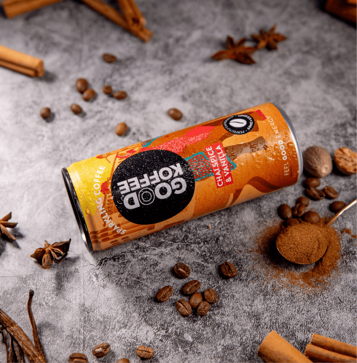 Chai Spice & Vanilla Sparkling Coffee - India can with coffee beans and spices around it