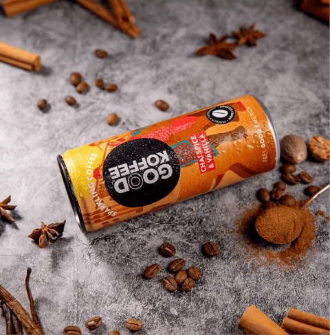 Chai Spice & Vanilla Sparkling Coffee - India can with coffee beans and spices around it