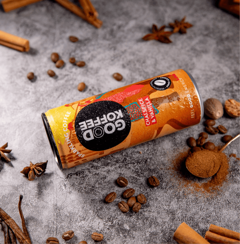 Chai Spice & Vanilla Sparkling Coffee - India can with coffee beans and spices around it