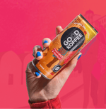 Person holding a can of Chai Spice & Vanilla Sparkling Coffee - India by Good Koffee with a vibrant pink background.