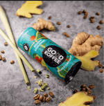 Lemongrass & Ginger Sparkling Coffee - Vietnam can surrounded by fresh lemongrass, ginger, and coffee beans on a textured surface.