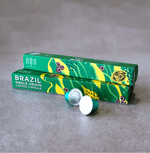 Brazil - Coffee Capsules showcasing premium Brazilian coffee in green packaging on a grey surface.