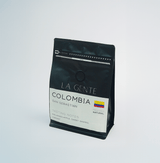 Colombia San Sebastian coffee package showcasing natural processing and tasting notes like molasses and sweet grapes.