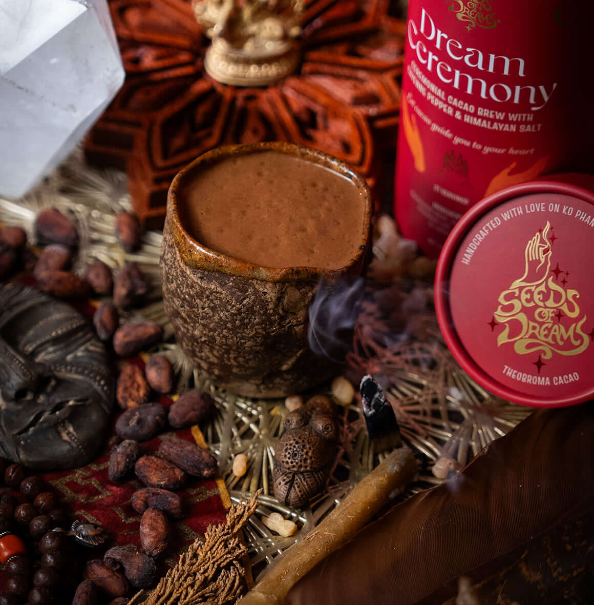 Dream Ceremony ceremonial cacao brew packaging with Cayenne Pepper & Himalayan Salt, featuring a bold red design with celestial gold accents.