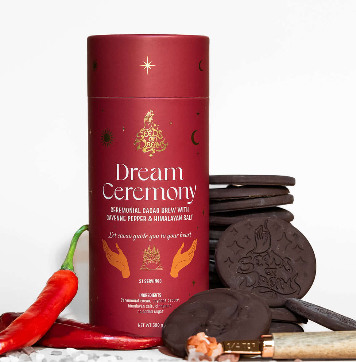 Dream Ceremony ceremonial cacao brew packaging with Cayenne Pepper & Himalayan Salt, featuring a bold red design with celestial gold accents.