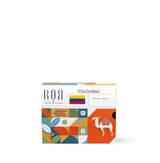 Colorful packaging of Drip Bag Box - Colombia with camel and geometric designs, offering smooth Colombian coffee.