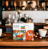 Drip Bag Box - Ethiopia on cafe counter with coffee cups