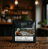 Ethiopia Aura Specialty Coffee bag in cozy café setting
