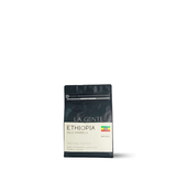 Ethiopia Guji Hambela coffee bag highlighting tasting notes of strawberry and dark plum.