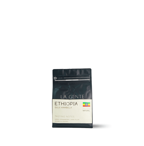 Ethiopia Guji Hambela coffee bag highlighting tasting notes of strawberry and dark plum.