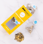 Organic Ginger & Lemon tea with lemongrass, lemon peel, ginger, and liquorice root, offering a sweet, spicy, and healing blend.