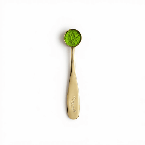 Matcha Serving Spoon in gold finish with matcha powder, perfect for precise measurements and elevating tea experience.