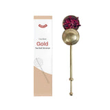 Gold tea ball strainer with fine mesh, perfect for brewing herbal tea and adding elegance to drinkware in Dubai.