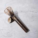 Bamboo whisk with 40 prongs, perfect for Koicha (thick) Matcha tea. Handmade from purple bamboo, 6-inch length, includes storage sleeve.