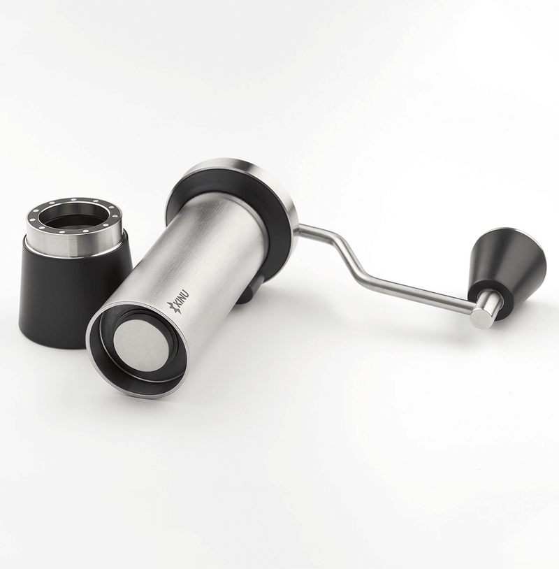 Professional coffee grinder with 47mm Black-Fusion conical burrs, smooth ball-bearing mechanism, stainless steel catch-cup, magnetic funnel, and EVA travel case for on-the-go brewing.
