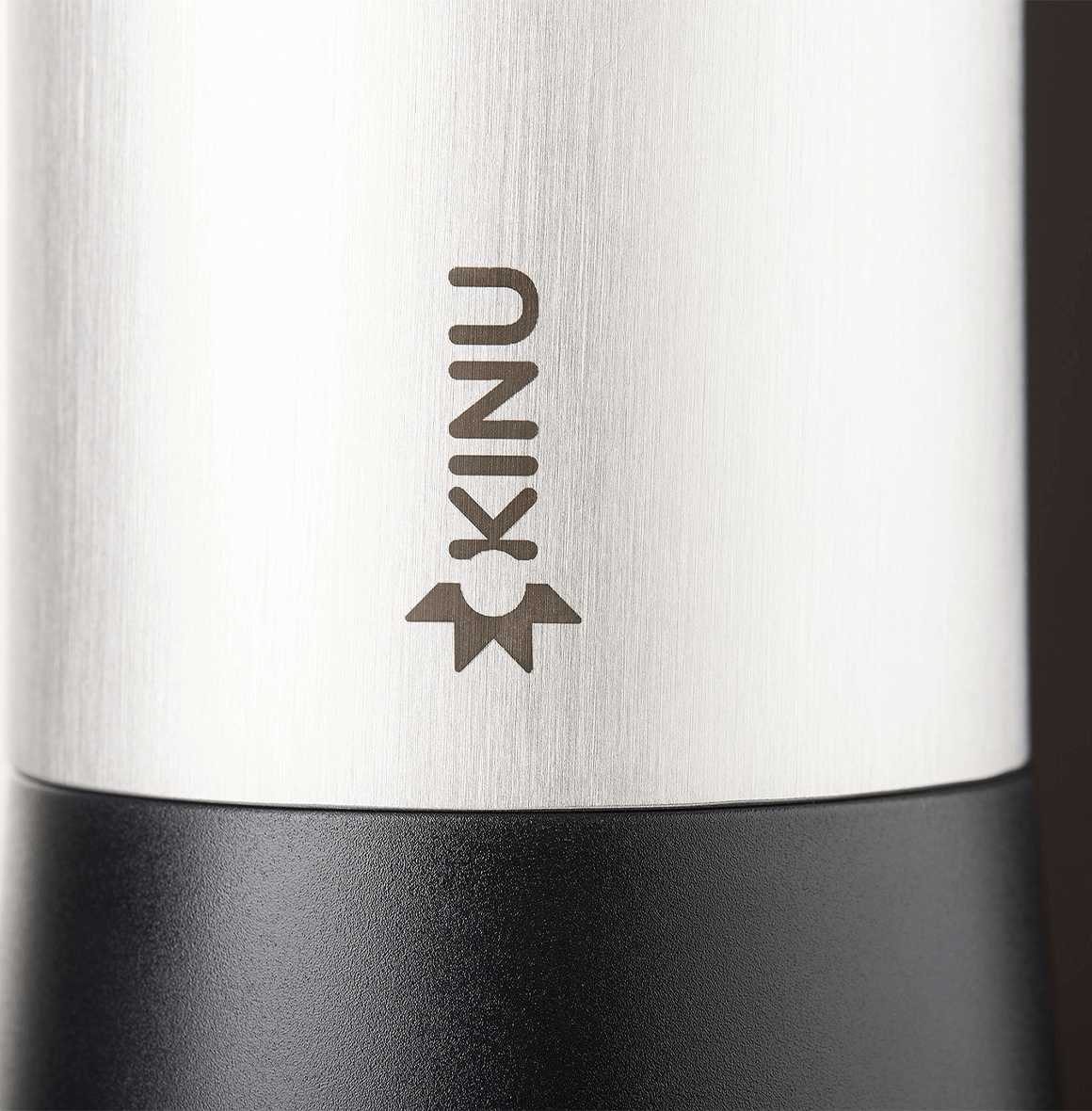 Professional coffee grinder with 47mm Black-Fusion conical burrs, smooth ball-bearing mechanism, stainless steel catch-cup, magnetic funnel, and EVA travel case for on-the-go brewing.