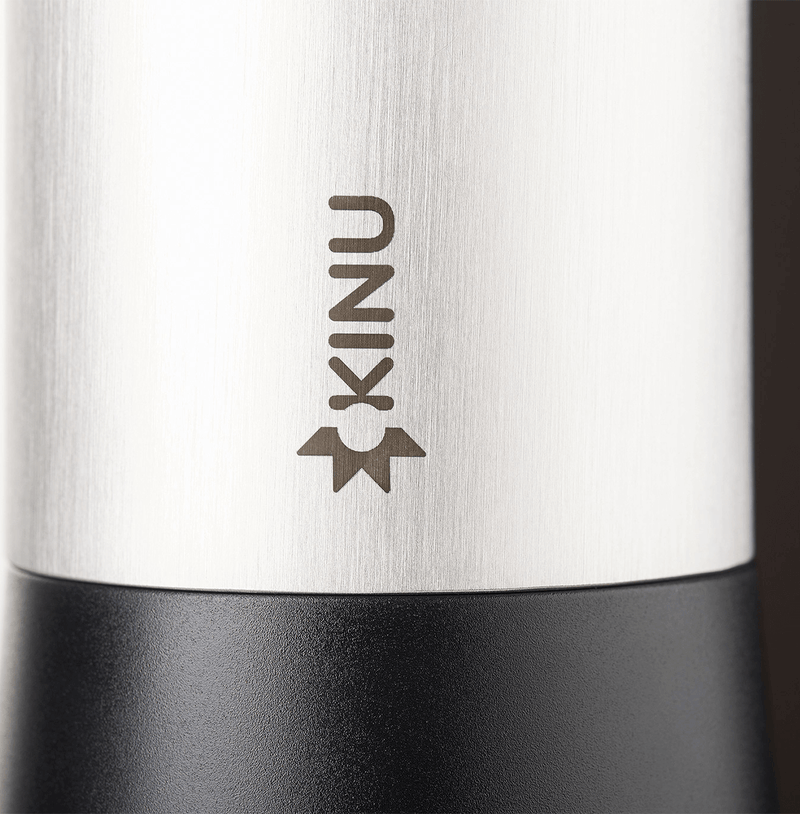 Professional coffee grinder with 47mm Black-Fusion conical burrs, smooth ball-bearing mechanism, stainless steel catch-cup, magnetic funnel, and EVA travel case for on-the-go brewing.