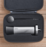 Professional coffee grinder with 47mm Black-Fusion conical burrs, smooth ball-bearing mechanism, stainless steel catch-cup, magnetic funnel, and EVA travel case for on-the-go brewing.