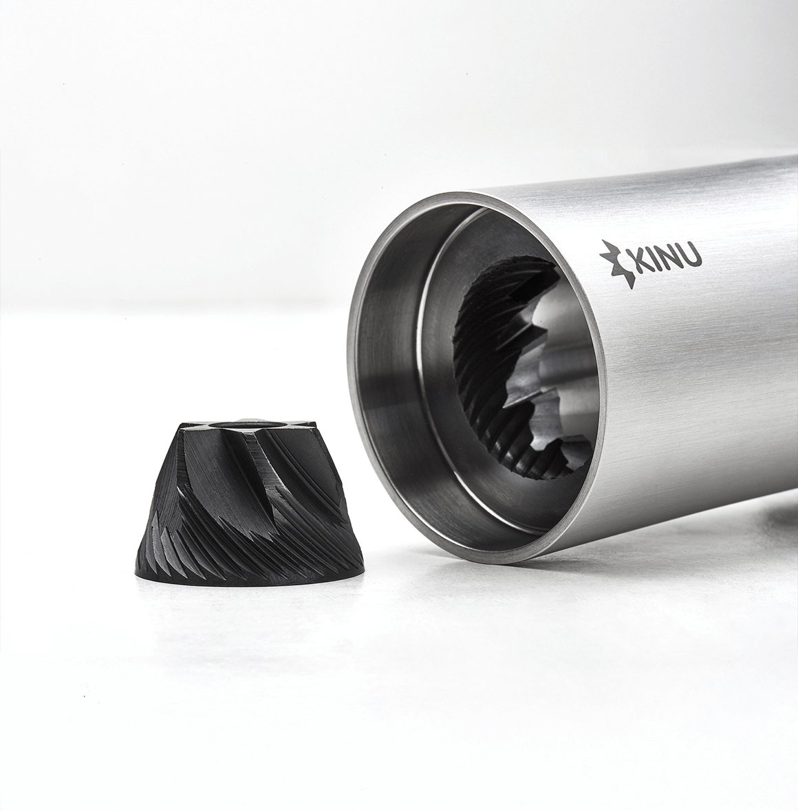 Professional coffee grinder with 47mm Black-Fusion conical burrs, smooth ball-bearing mechanism, stainless steel catch-cup, magnetic funnel, and EVA travel case for on-the-go brewing.
