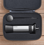 Kinu manual coffee grinder with 47mm Black-Fusion conical burrs, smooth ball-bearing mechanism, and EVA travel case, engineered for speed, precision, and portability.