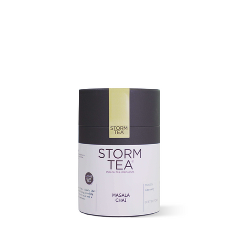 Masala Chai Tea package with spicy ingredients, featuring Assam black tea, ginger, cloves, cinnamon, cardamom, fennel, and aniseed.