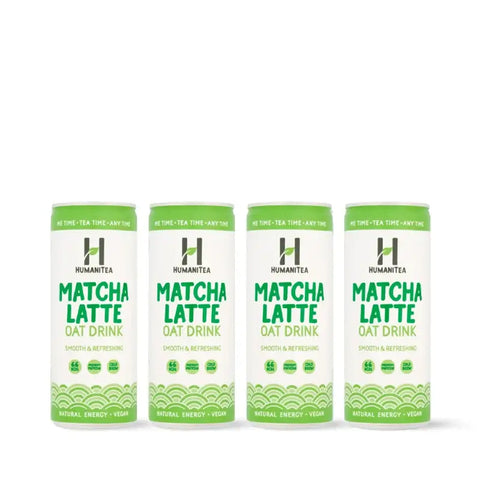 Four cans of Human Tea Matcha Latte Oat Drink on a white background