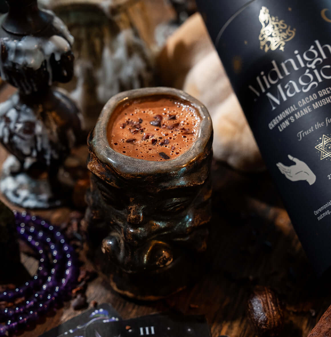 Midnight Magic ceremonial cacao brew packaging with Lion’s Mane Mushroom, featuring a celestial black design with gold accents.