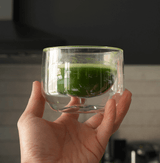 Hand-blown glass mug for whisking, sipping, and serving. Sleek, versatile, and comfortable design for daily use.