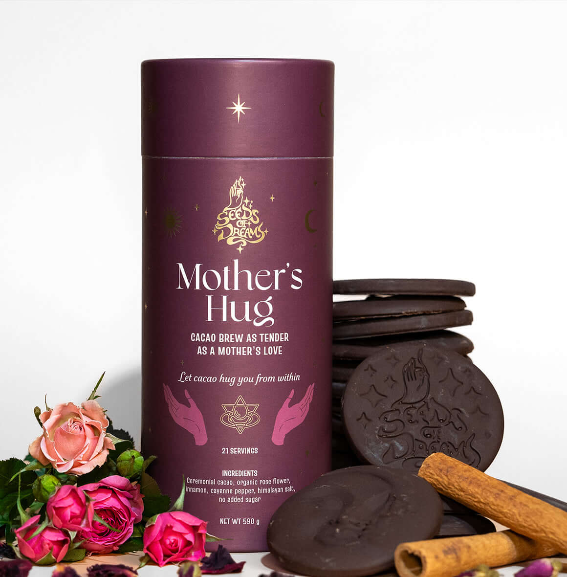 Mother’s Hug cacao brew packaging with a warm maroon design, featuring celestial gold details and spiritual hand illustrations.
