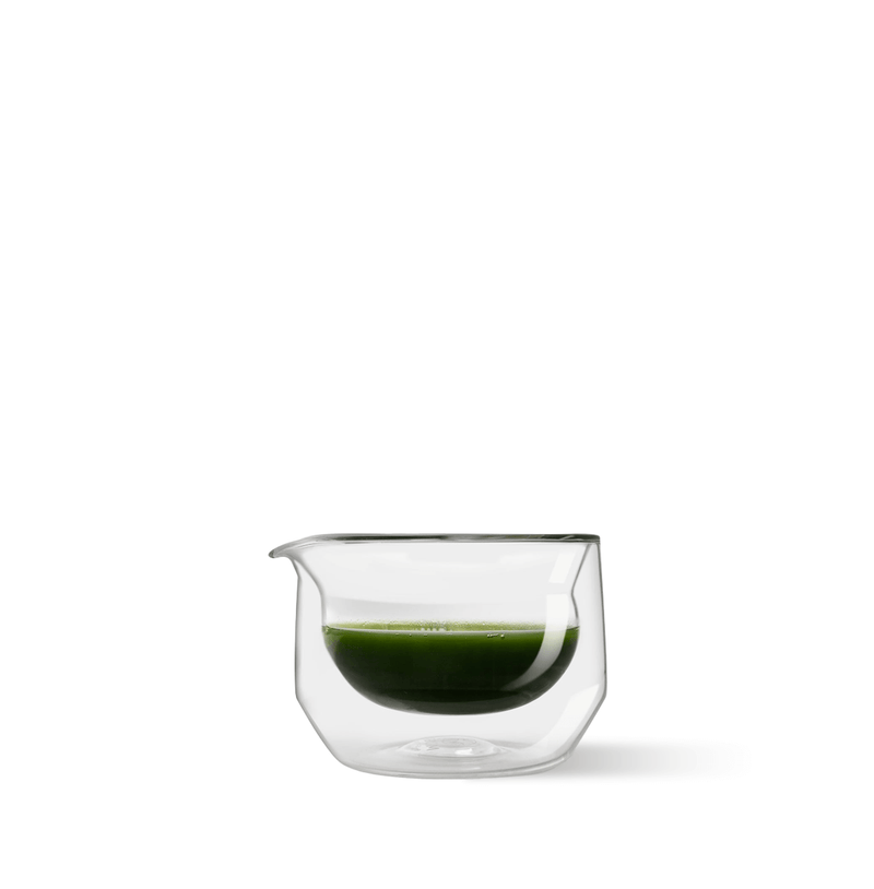 Hand-blown glass mug for whisking, sipping, and serving. Sleek, versatile, and comfortable design for daily use.
