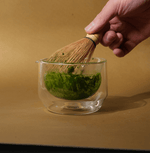 Hand-blown glass mug for whisking, sipping, and serving. Sleek, versatile, and comfortable design for daily use.