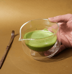 Hand-blown glass mug for whisking, sipping, and serving. Sleek, versatile, and comfortable design for daily use.